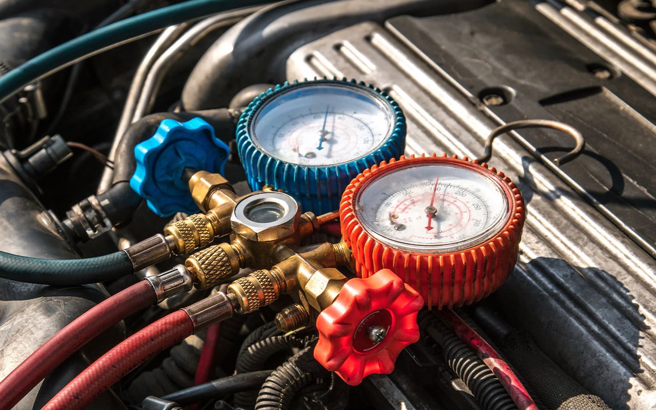 ASE Certified mechanic performing AC Service & Repair