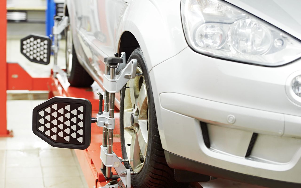 ASE Certified mechanic performing Wheel Alignment